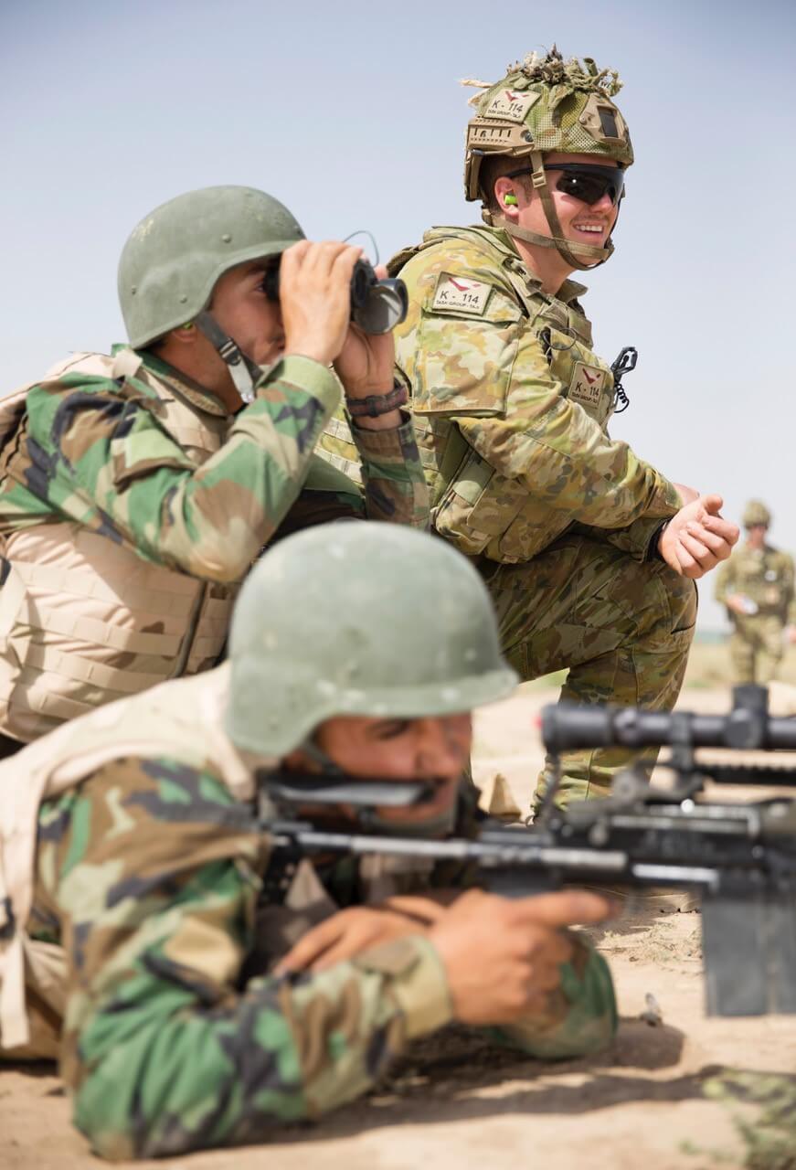 CPL Lindsay Albion observes his Iraqi Rangers during a marksmanship range at Camp Taji, Iraq.